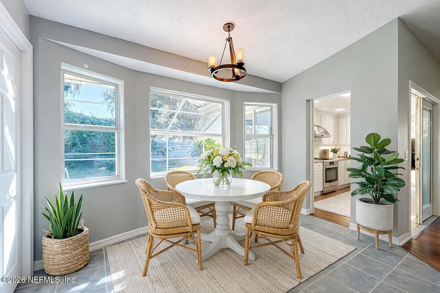 3061 South Franklin Terrace Inverness, FL 34450 - Photo 30 of 65 a dining room with furniture potted plants and wooden floor