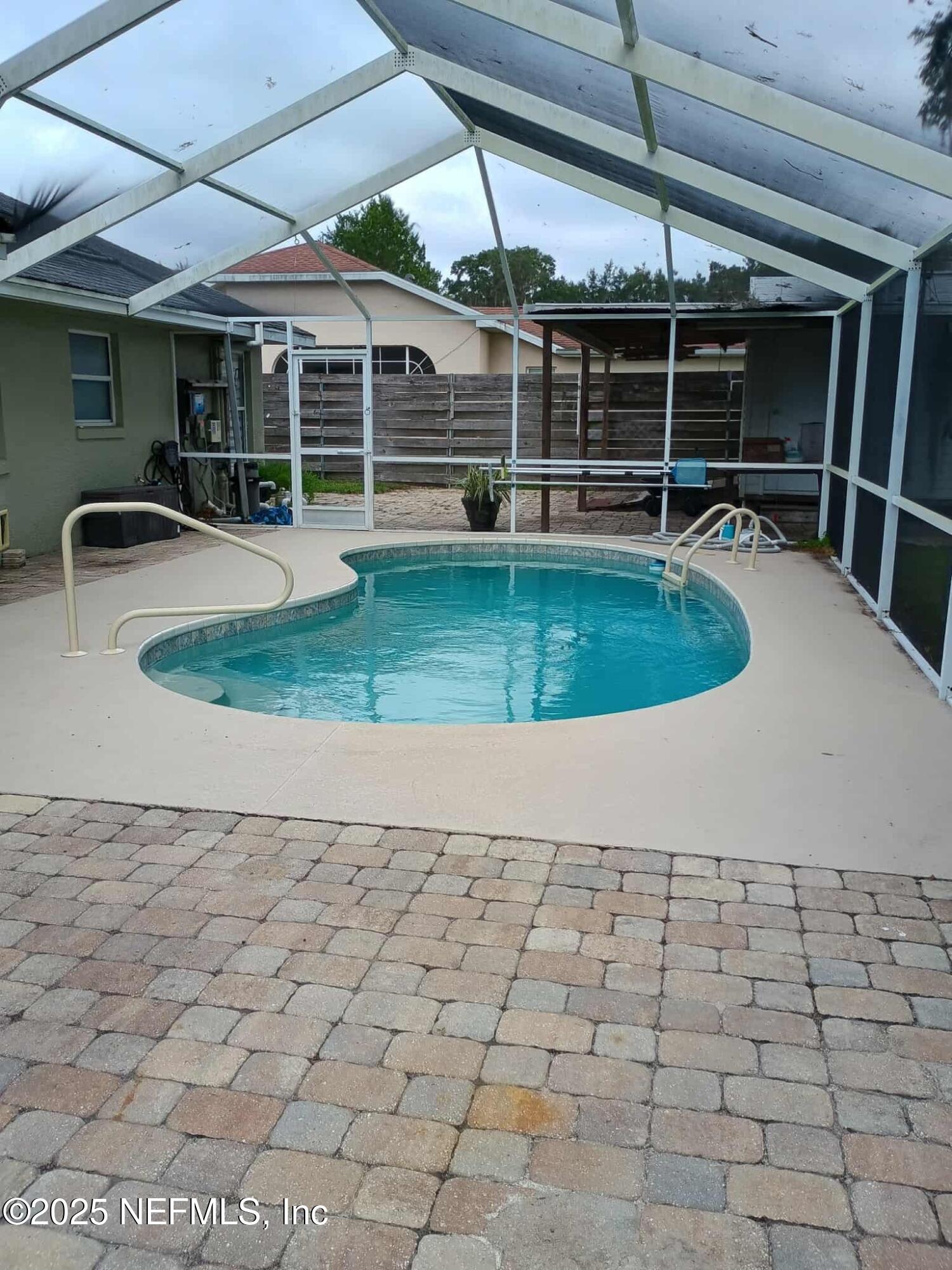 3061 South Franklin Terrace Inverness, FL 34450 - Photo 3 of 65 a view of a backyard with table and chairs