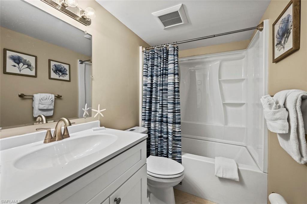 200 Lenell Road, Unit 215 Fort Myers Beach, FL 33931 - Photo 11 of 29 a bathroom with a sink toilet and shower