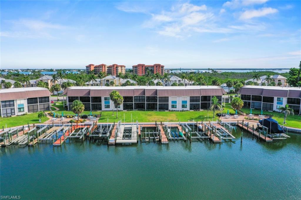 200 Lenell Road, Unit 215 Fort Myers Beach, FL 33931 - Photo 22 of 29 an aerial view of a house with swimming pool patio and outdoor seating