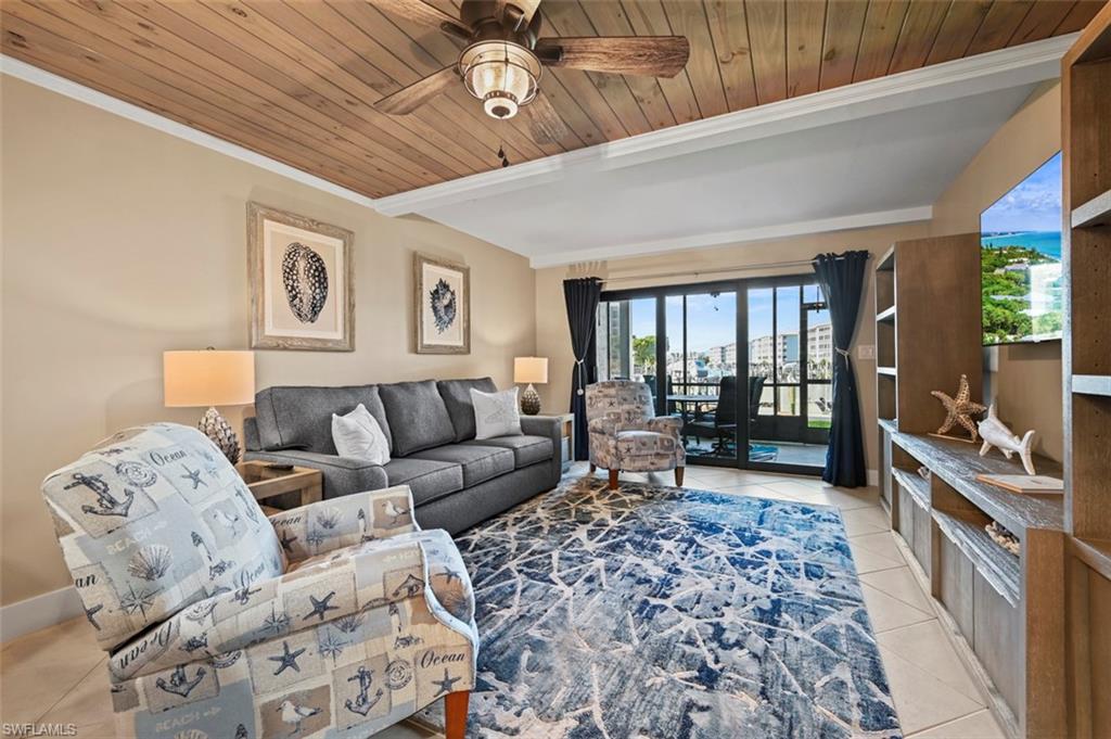 200 Lenell Road, Unit 215 Fort Myers Beach, FL 33931 - Photo 6 of 29 a living room with furniture and wooden floor