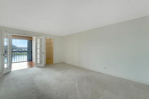 an empty room with large sliding door