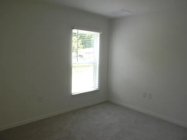 a bathroom with a toilet and shower