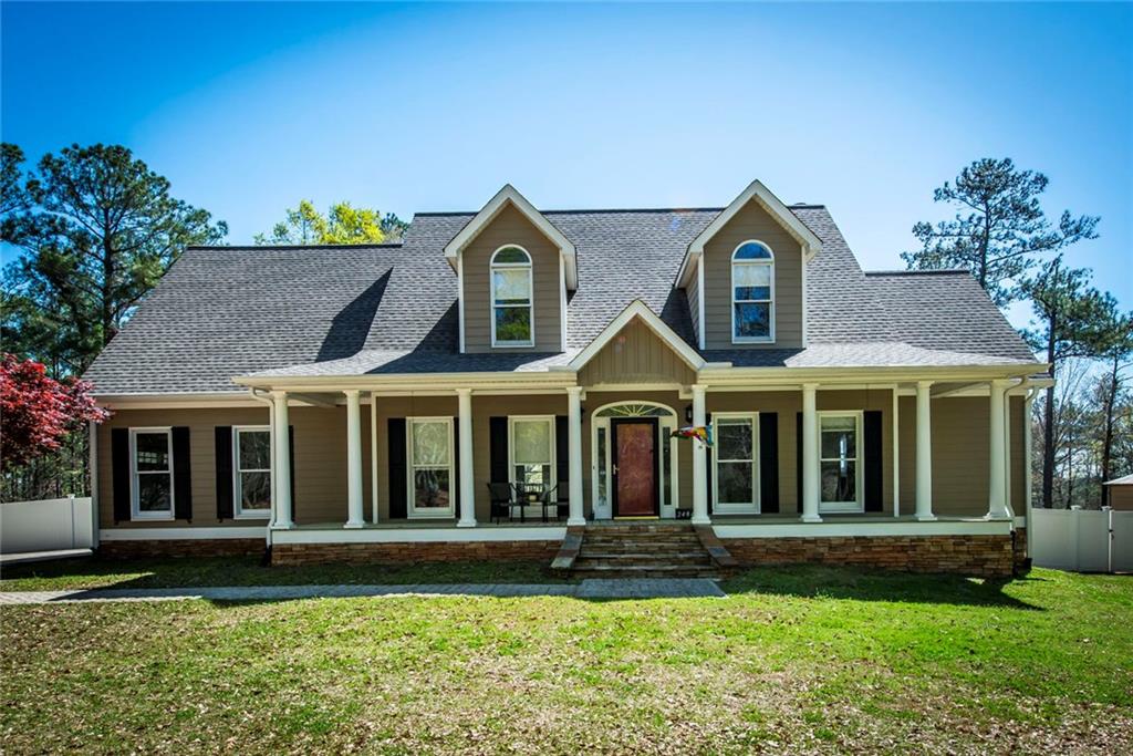 2484 Welcome Road Newnan, GA 30263 - Photo 1 of 1 a front view of a house with a yard