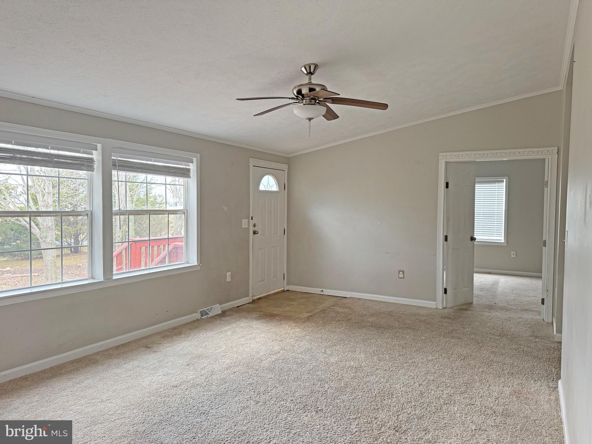 238 Silver Leaf Lane Dover, DE 19901 - Photo 3 of 20 wooden floor and windows in an empty room