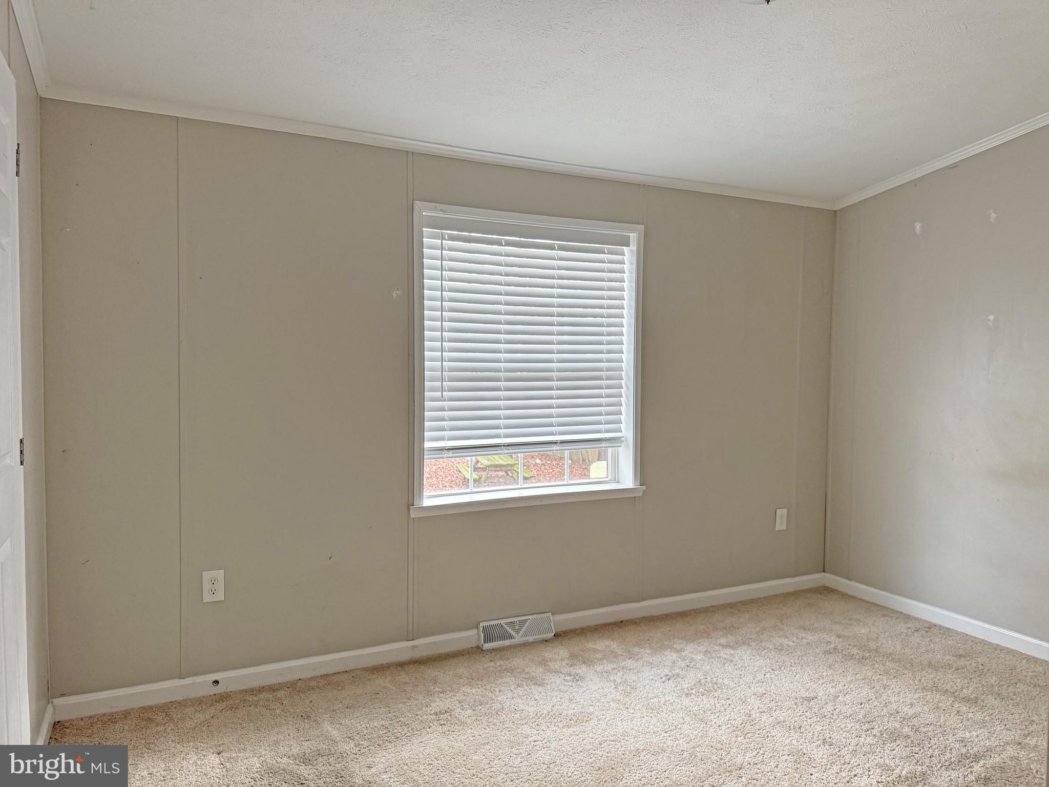 238 Silver Leaf Lane Dover, DE 19901 - Photo 8 of 20 a view of an empty room with a window