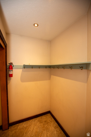 1500 Sumac Drive Logan, UT 84321 - Photo 21 of 42 Mud room featuring a light blue shelf with hooks, recessed ceiling lighting, and wood-finish flooring