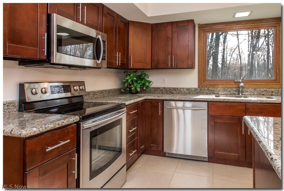 3455 Old Brainard Road Cleveland, OH 44124 - Photo 9 of 24 New Eat-in Kitchen with Granite Counters, Cherry Cabinets, Island with Breakfast Bar & Stainless Steel Appliances