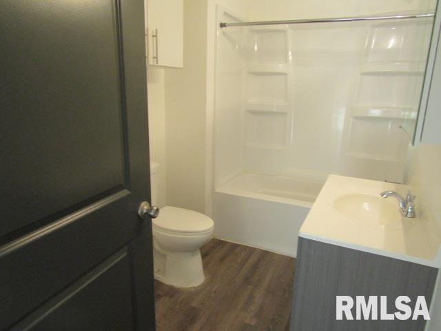 1506 Hillside Road Rosiclare, IL 62982 - Photo 16 of 29 a bathroom with a sink a toilet and shower
