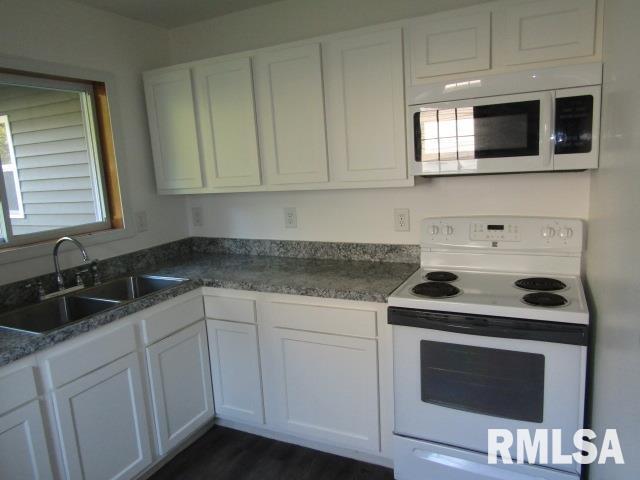 1506 Hillside Road Rosiclare, IL 62982 - Photo 27 of 29 a kitchen with granite countertop white cabinets stainless steel appliances and sink