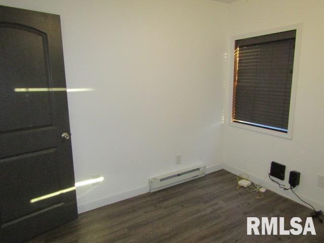 1506 Hillside Road Rosiclare, IL 62982 - Photo 29 of 29 an empty room with wooden floor and closet