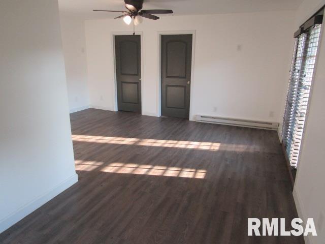 1506 Hillside Road Rosiclare, IL 62982 - Photo 5 of 29 a view of an empty room with wooden floor and a window