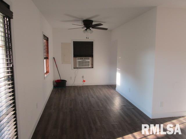 1506 Hillside Road Rosiclare, IL 62982 - Photo 10 of 29 a view of a livingroom with a hardwood floor and a ceiling fan
