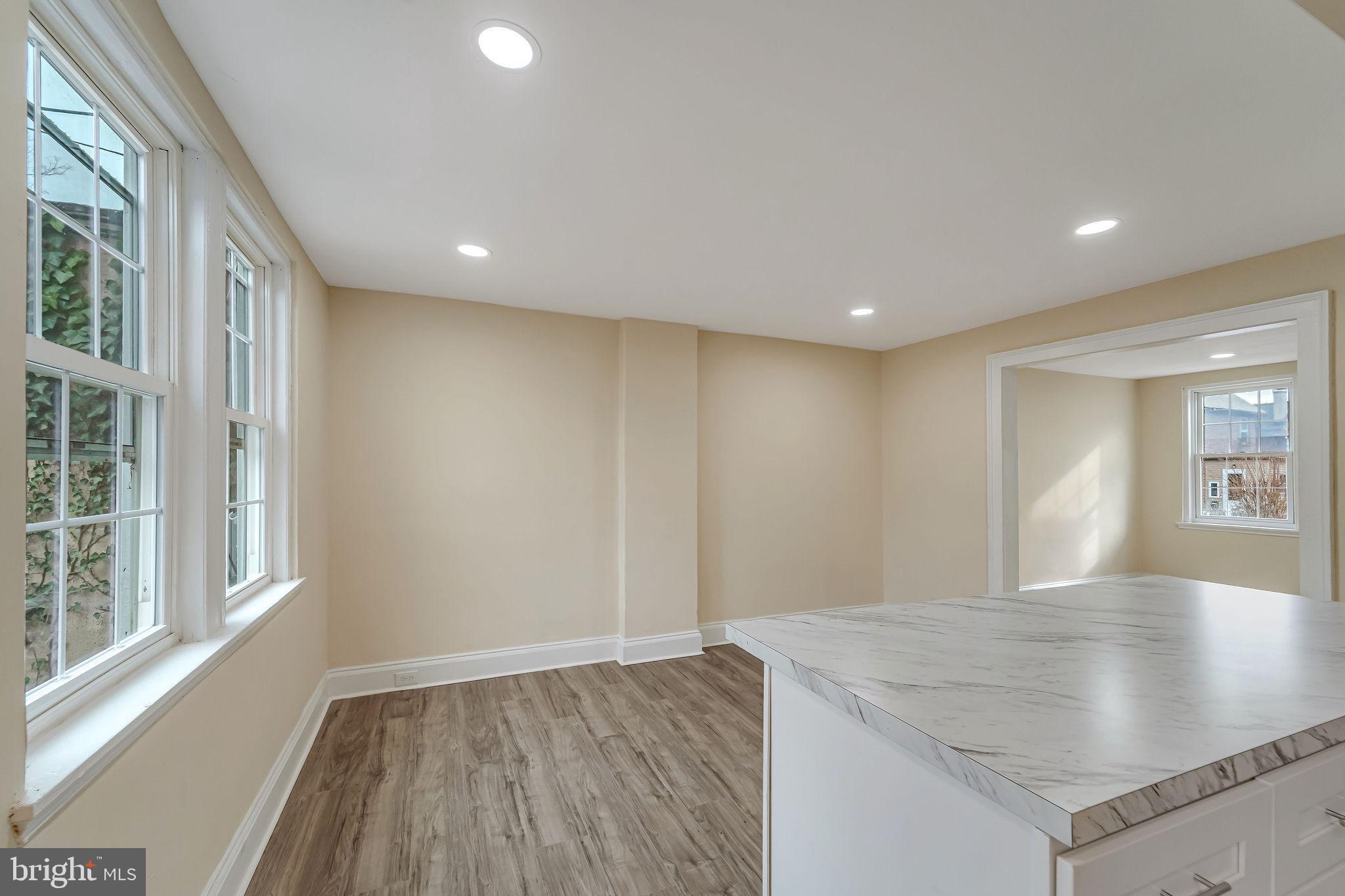 1029 Ironside Road Camden, NJ 08104 - Photo 11 of 25 a view of a kitchen with a sink and dishwasher with wooden floor