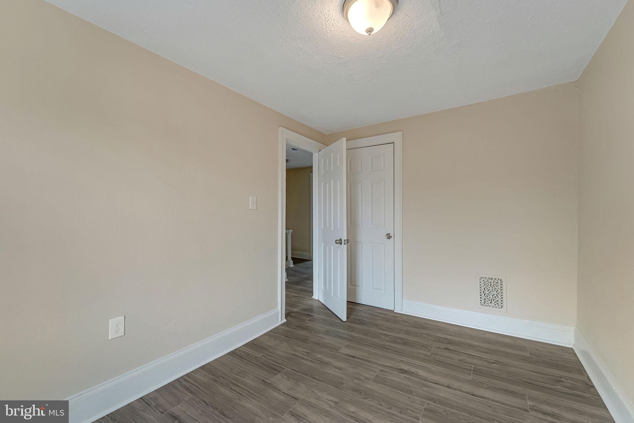 1029 Ironside Road Camden, NJ 08104 - Photo 17 of 25 a view of an empty room and wooden floor