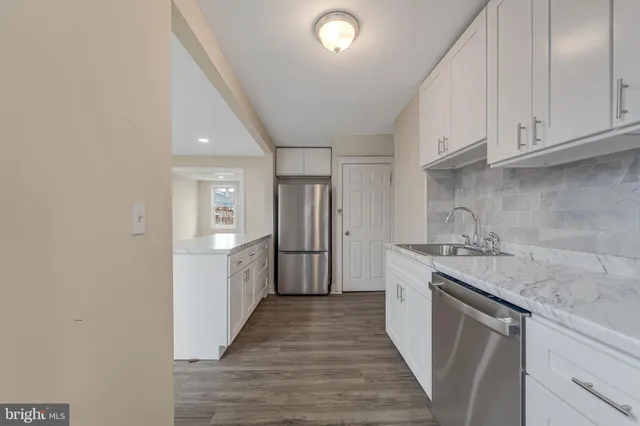 a kitchen with a sink and cabinets
