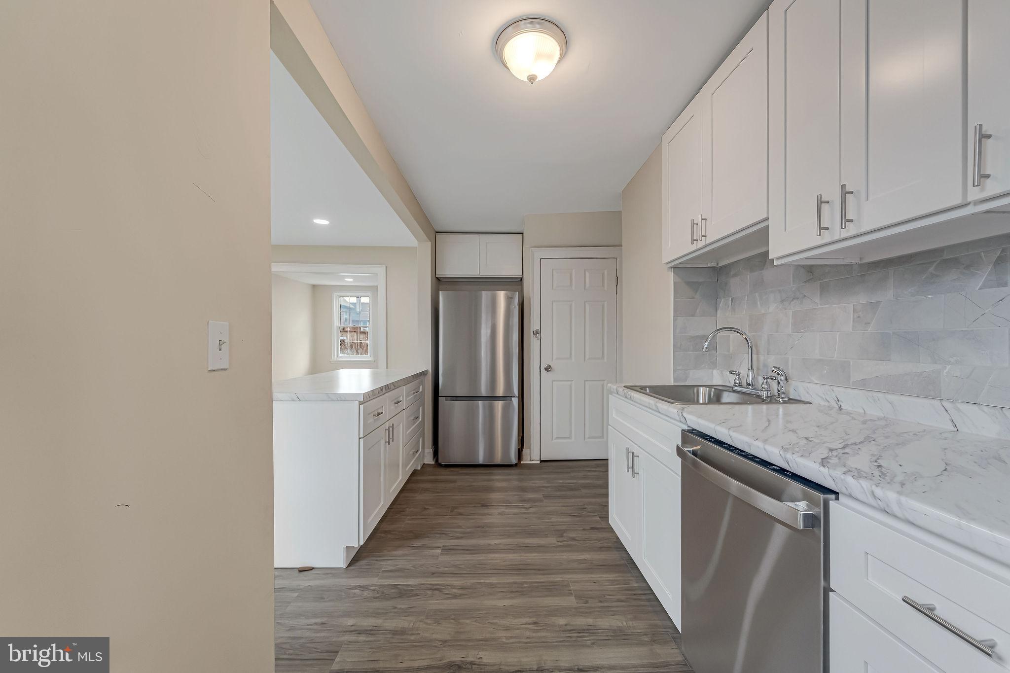 1029 Ironside Road Camden, NJ 08104 - Photo 9 of 25 a kitchen with a sink and cabinets