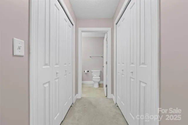 a view of a bathroom from a hallway