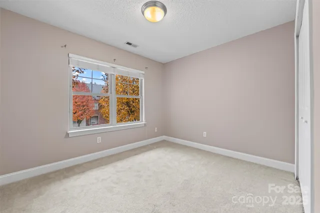 an empty room with windows and window