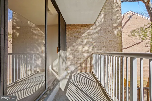 a view of balcony with wooden floor