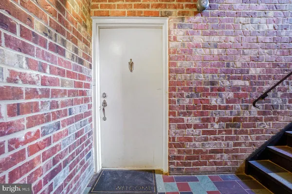 a brick building with a black and white checkered floor