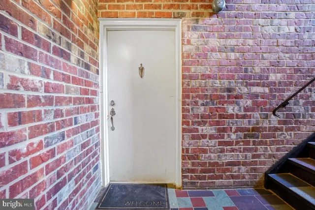 a brick building with a black and white checkered floor
