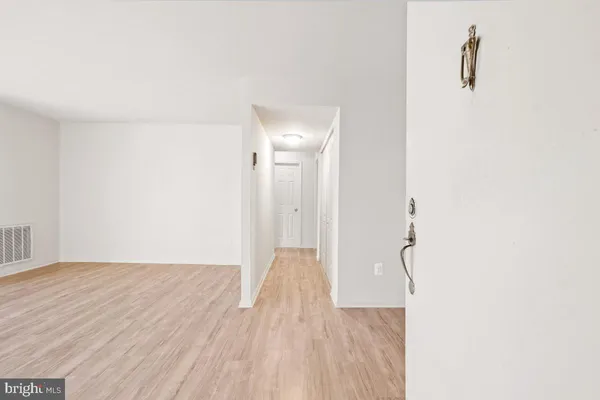 a view of a livingroom with wooden floor