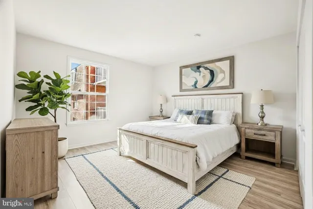 a bedroom with a large bed and a window