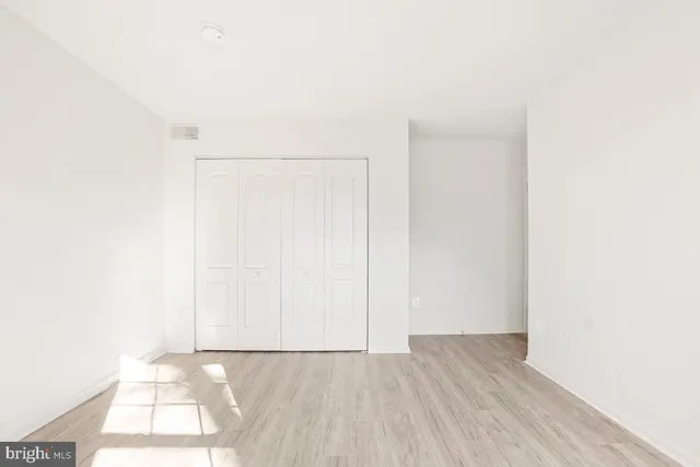 a view of a small space with wooden floor and small space