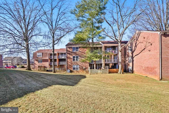 a view of a building with snow on the road