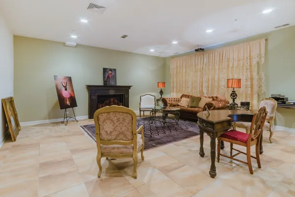 a living room with furniture a desk and chair