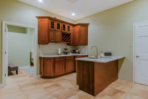 a kitchen with stainless steel appliances granite countertop a sink counter space and cabinets