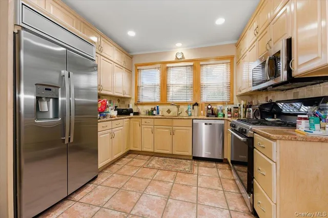 a kitchen with a refrigerator and cabinets