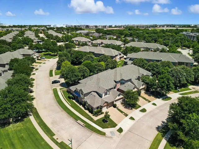an aerial view of a house with a garden