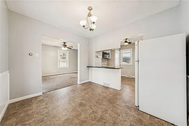 a view of a kitchen with a sink and dishwasher