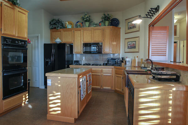 1050 Spring Road Shelter Cove, CA 95589 - Photo 33 of 42 a kitchen with a stove a refrigerator and a sink