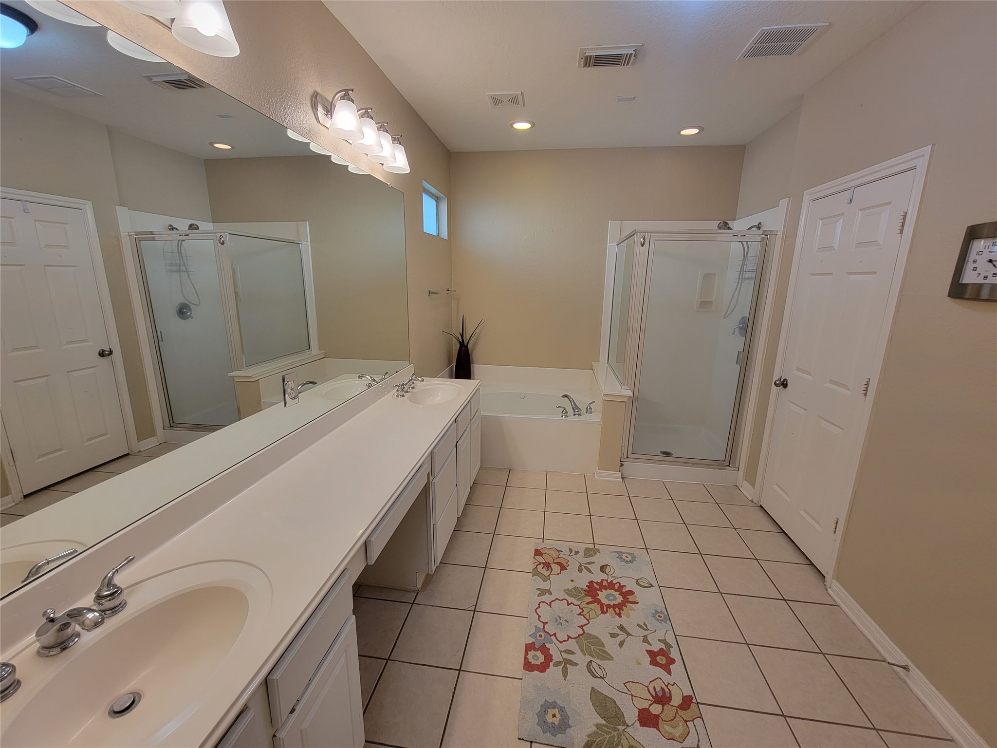 130 Zephyr Bend Place The Woodlands, TX 77381 - Photo 12 of 29 a bathroom with a sink a toilet and mirror