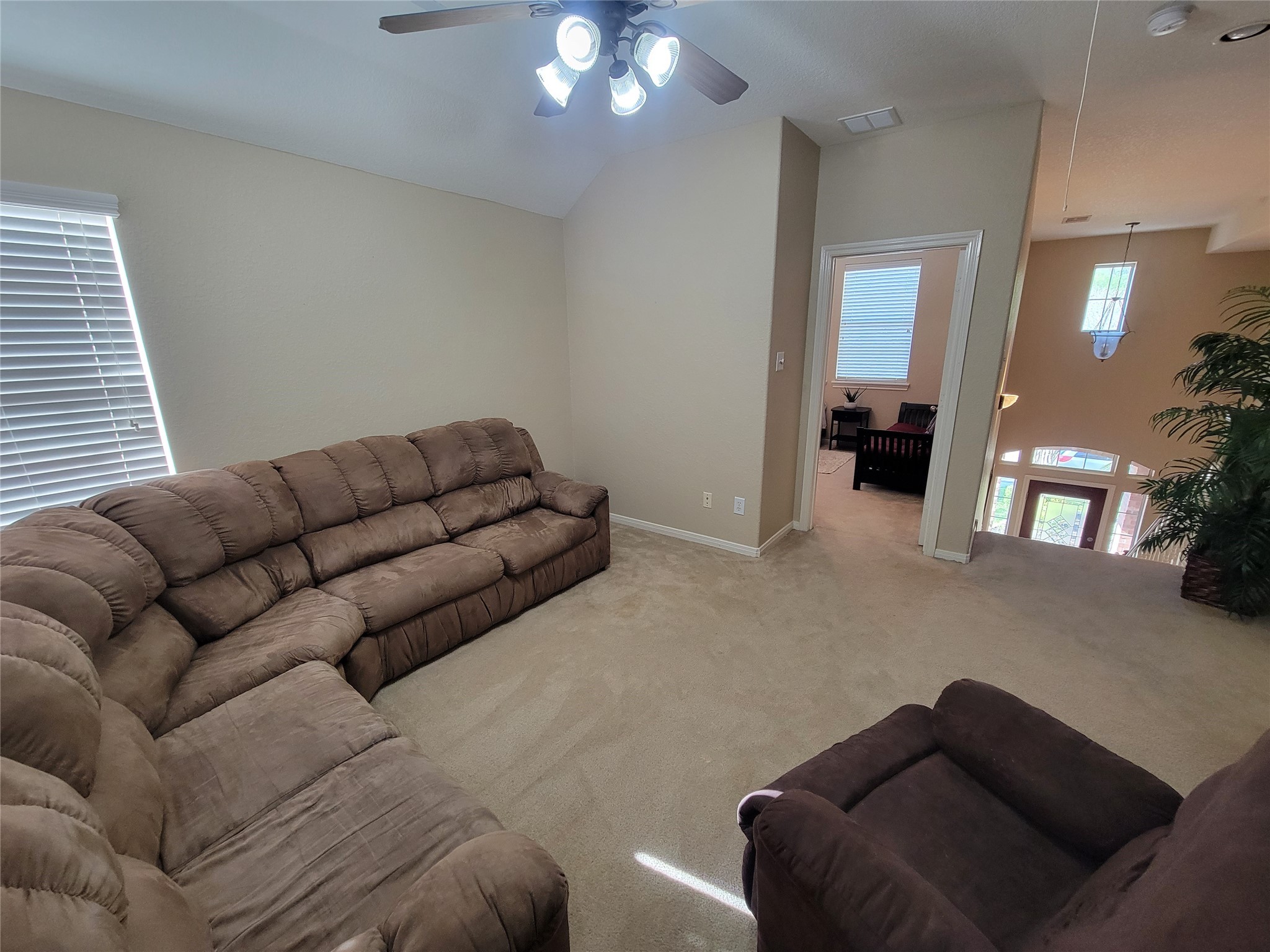 130 Zephyr Bend Place The Woodlands, TX 77381 - Photo 18 of 29 a living room with furniture and a mirror