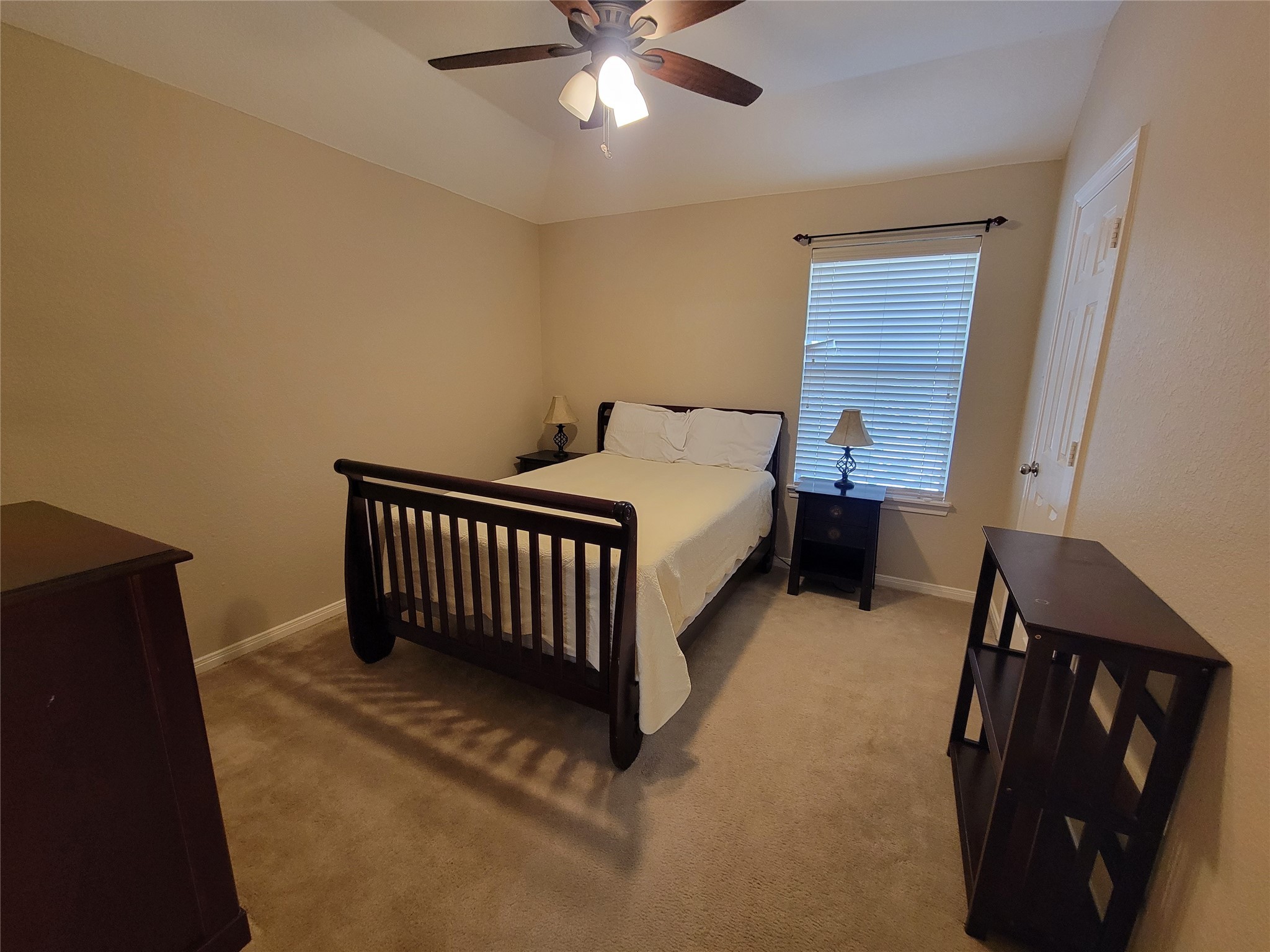130 Zephyr Bend Place The Woodlands, TX 77381 - Photo 20 of 29 a bed room with a bed and a window