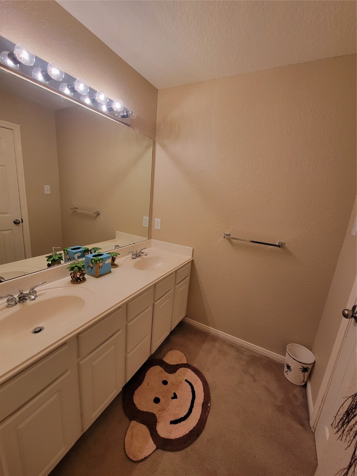 130 Zephyr Bend Place The Woodlands, TX 77381 - Photo 22 of 29 a bathroom with a sink and a mirror