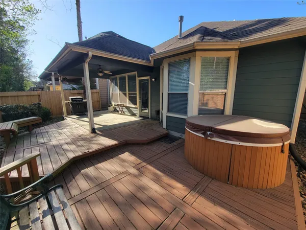 a view of house with backyard and furniture