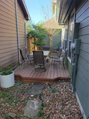 a front view of a house with a yard and potted plants