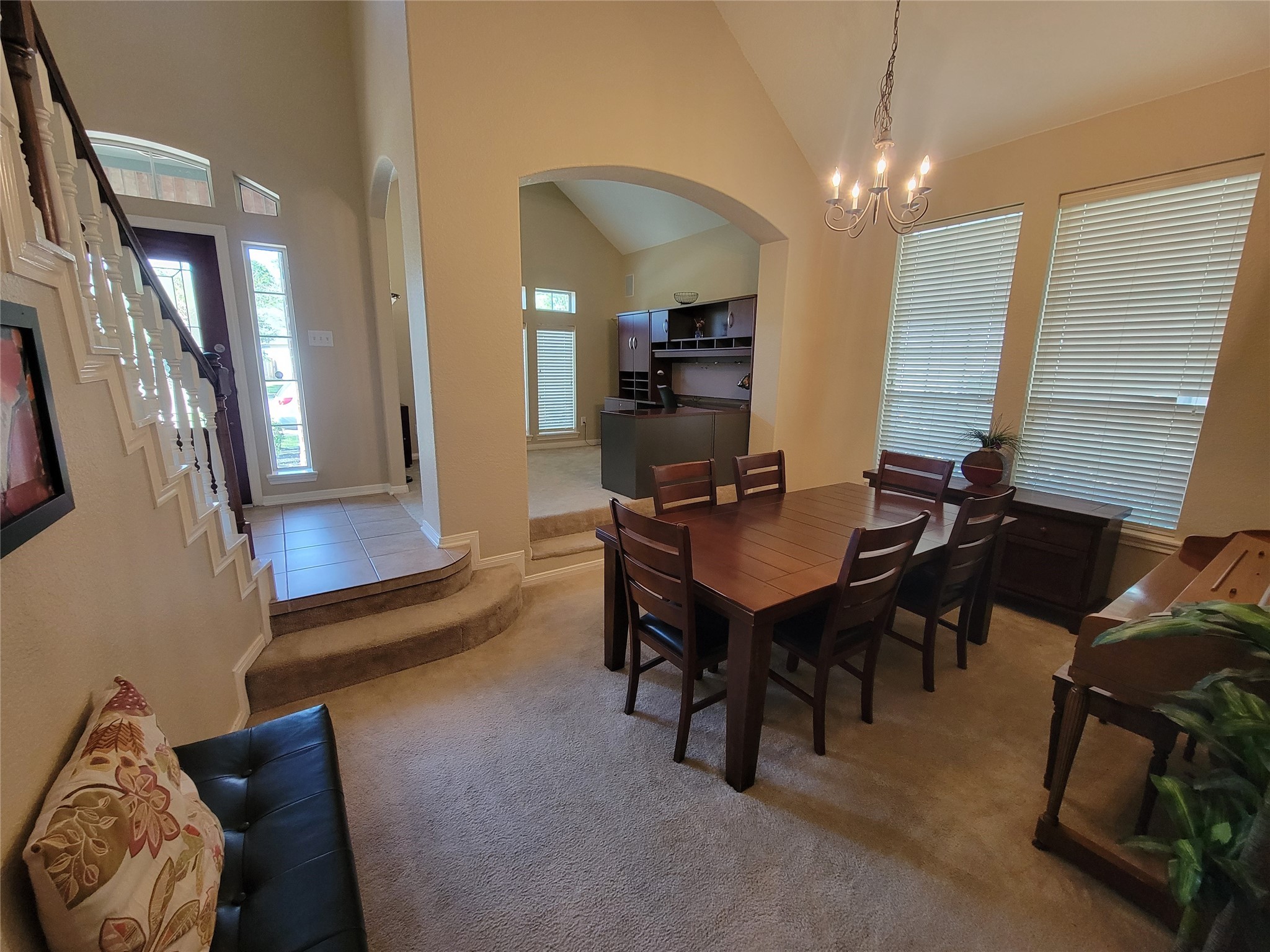 130 Zephyr Bend Place The Woodlands, TX 77381 - Photo 7 of 29 a view of a livingroom with furniture and a dining table