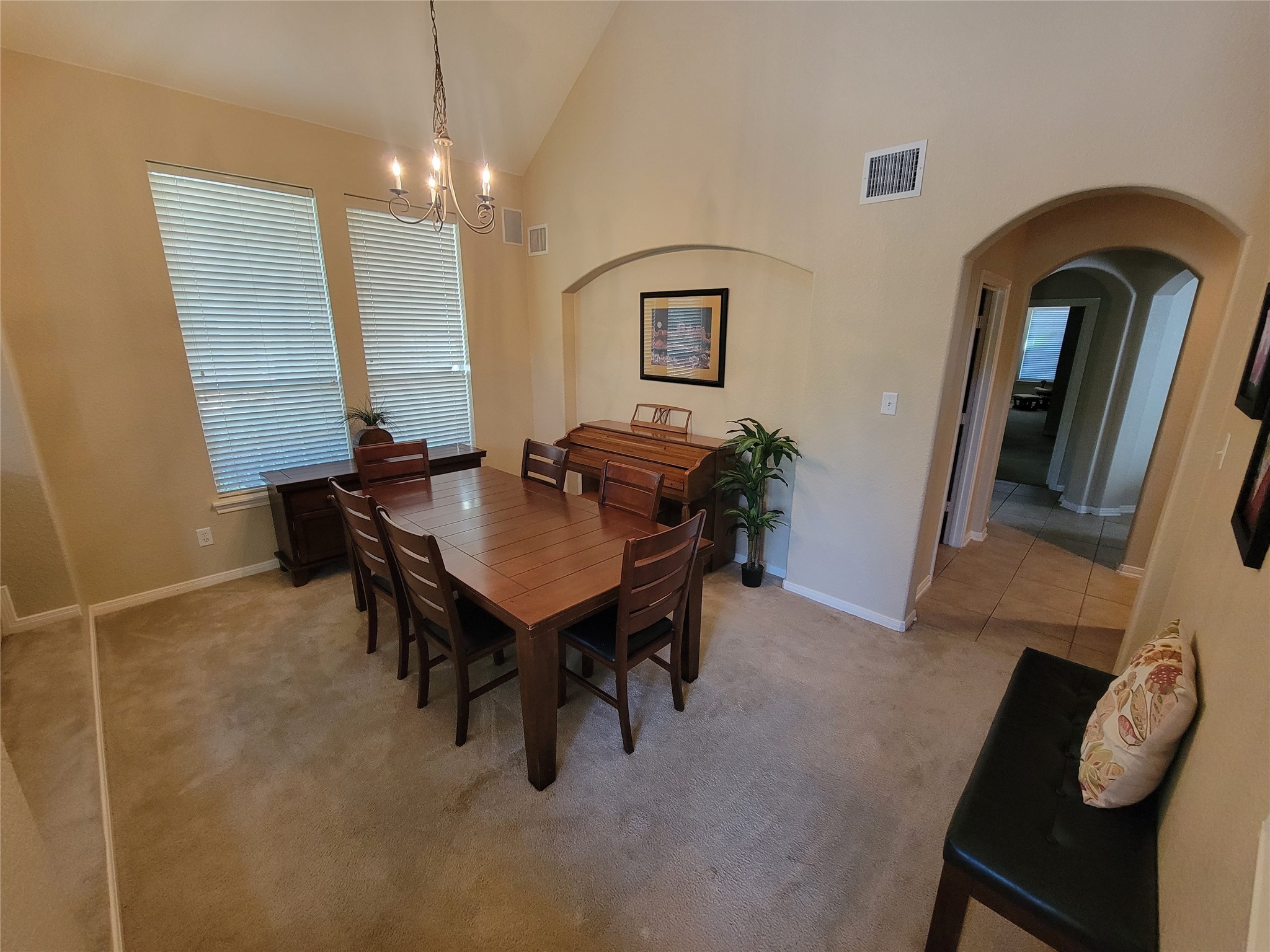 130 Zephyr Bend Place The Woodlands, TX 77381 - Photo 8 of 29 a view of a dining room with furniture and chandelier