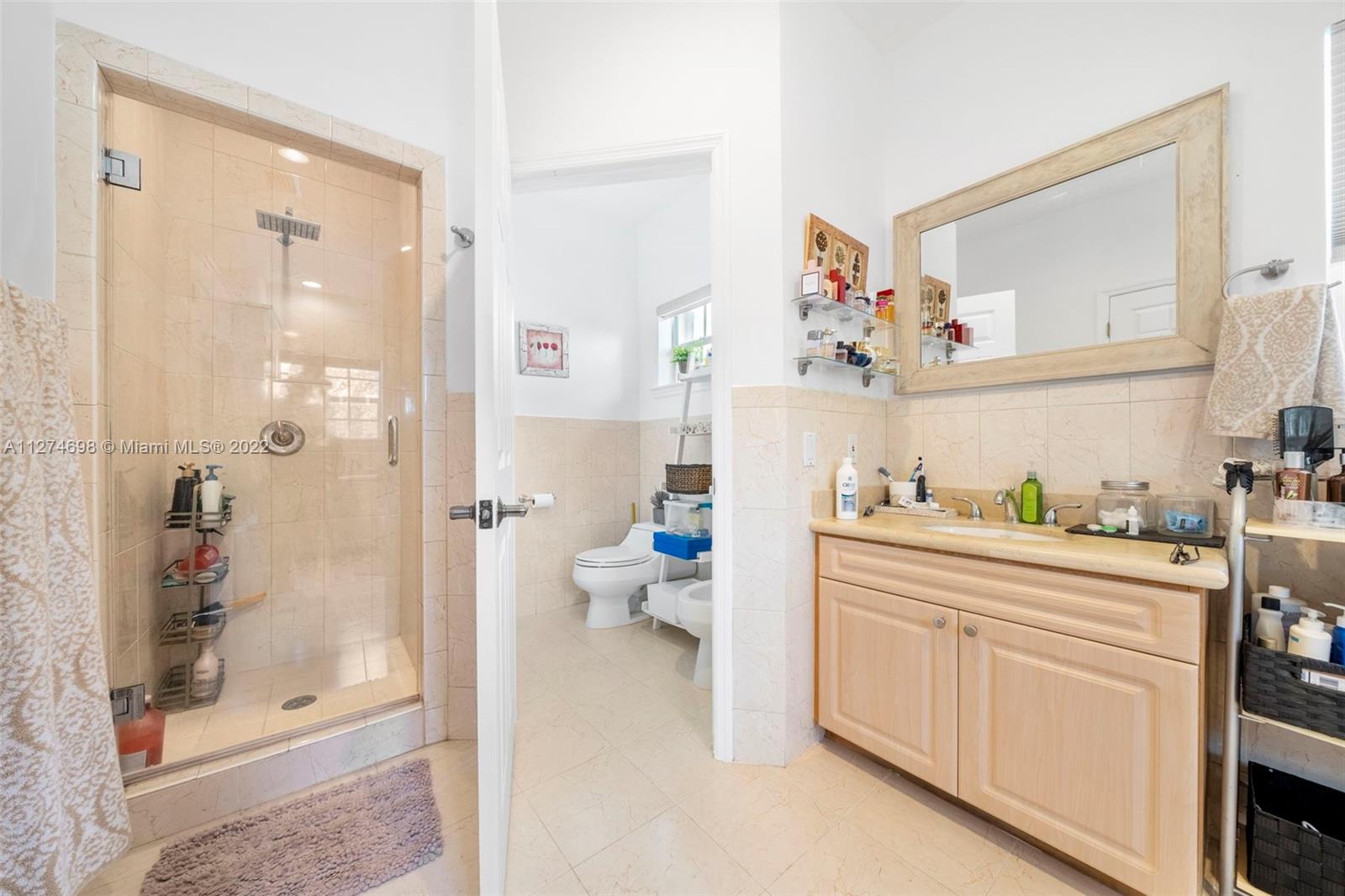 442 Fernwood Road Key Biscayne, FL 33149 - Photo 15 of 33 a kitchen with a refrigerator and sink