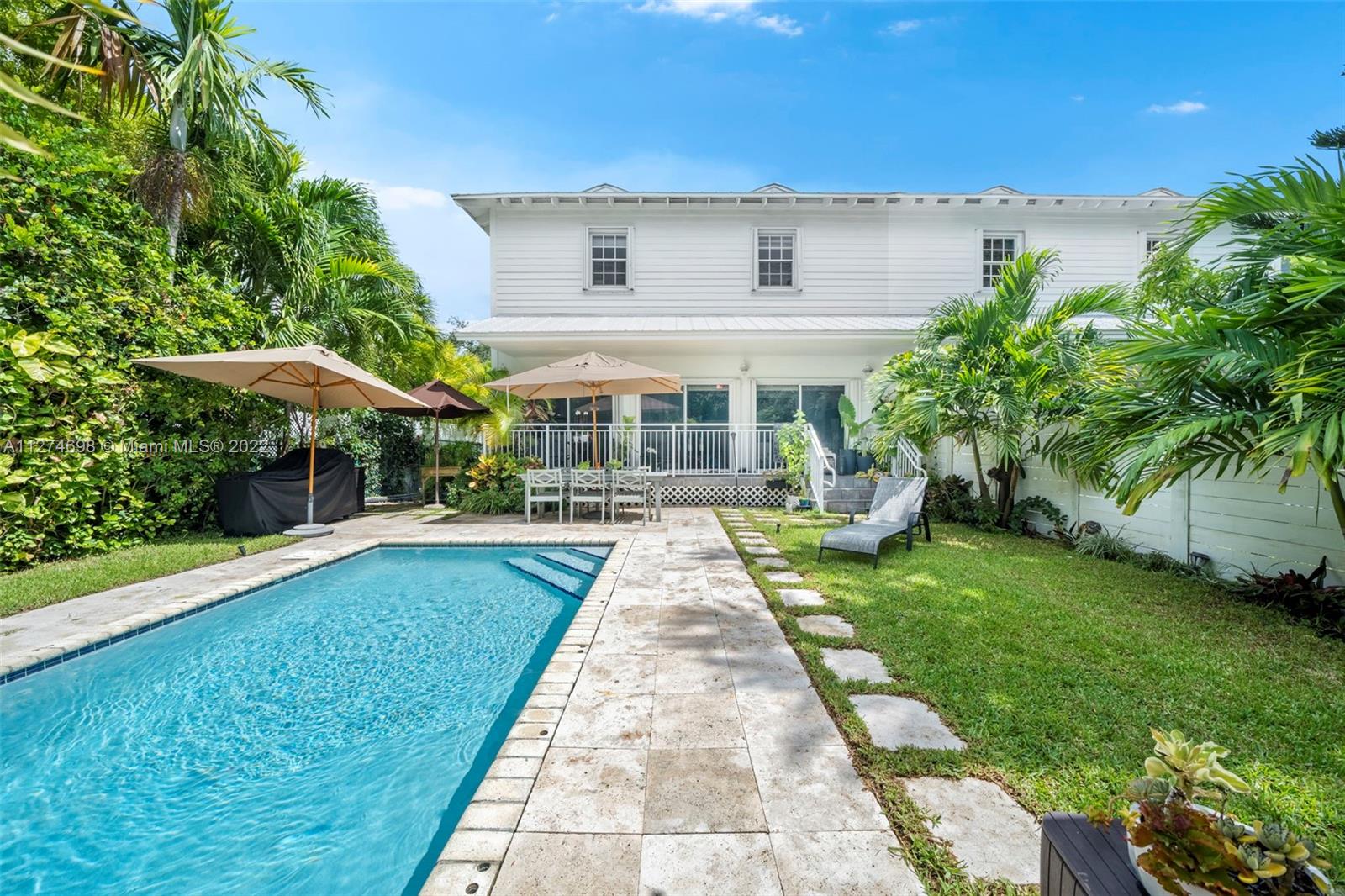 442 Fernwood Road Key Biscayne, FL 33149 - Photo 21 of 33 a view of a house with a yard
