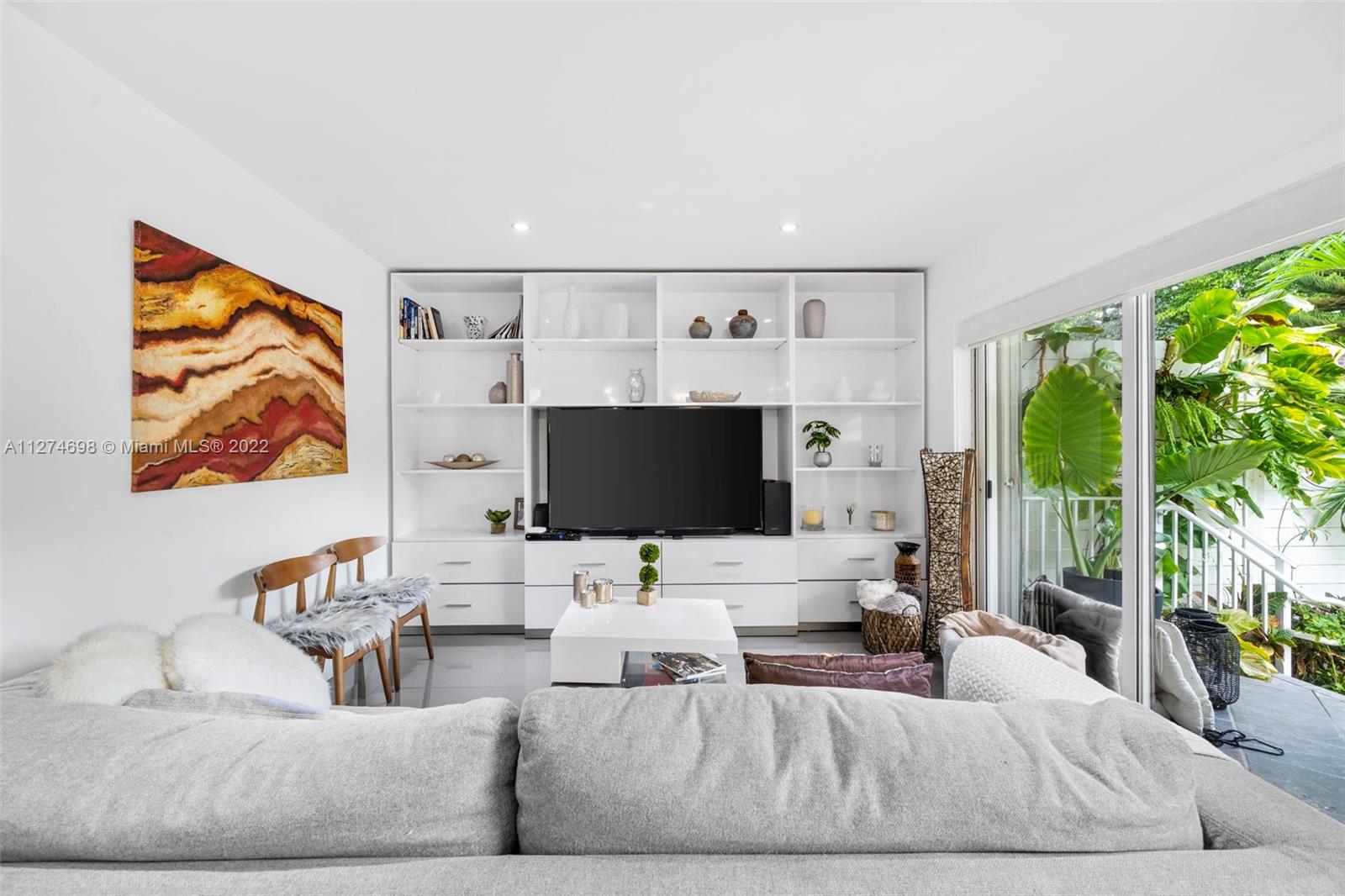 442 Fernwood Road Key Biscayne, FL 33149 - Photo 6 of 33 a living room with furniture and a flat screen tv