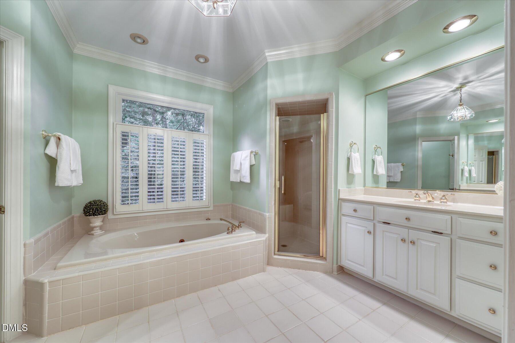 1904 Merion Place Raleigh, NC 27615 - Photo 18 of 43 Primary bathroom with separate shower and garden tub.