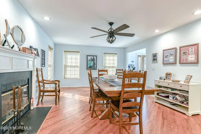 a view of a dining area with furniture and wooden floor