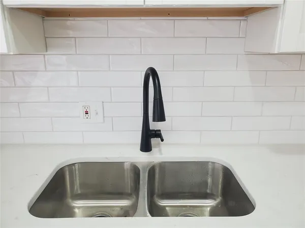 a bathroom with a bathtub and a toilet